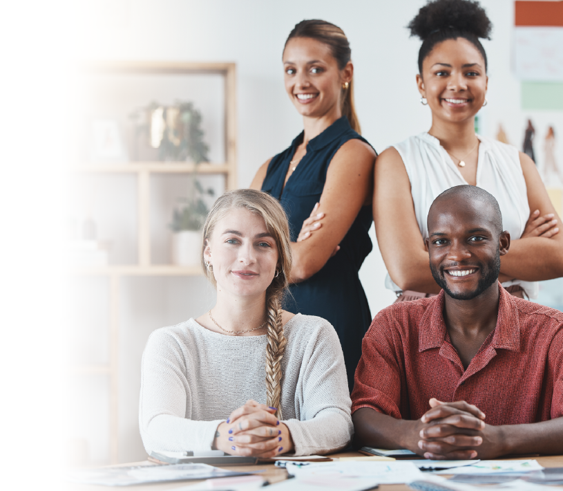 A diverse group of four young students smiling confidently.